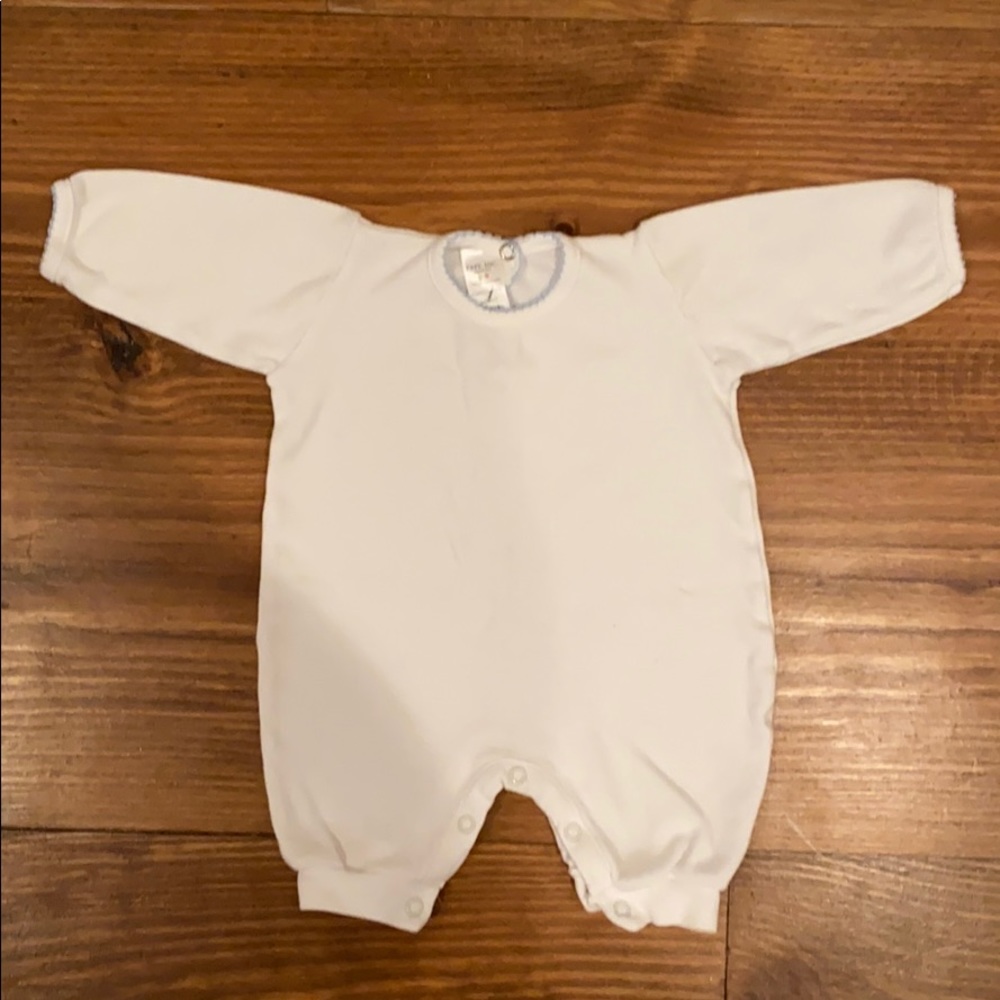 White outfit with blue trim